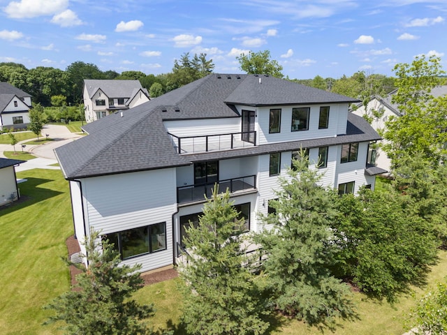 20 Pinnacle Ct, Naperville, IL 60565 - back of property with a balcony, a shingled roof, and a lawn