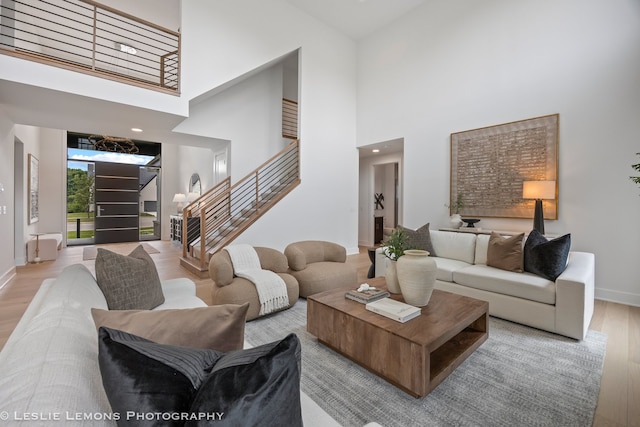20 Pinnacle Ct, Naperville, IL 60565 - living room with wood finished floors, stairway, a high ceiling, and a chandelier