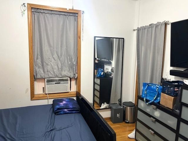 5536 S Albany Ave, Chicago, IL 60629 - bedroom featuring wood finished floors and cooling unit