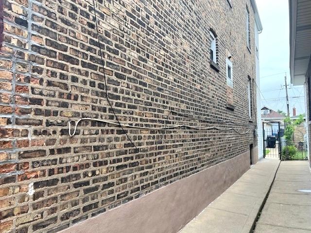 5536 S Albany Ave, Chicago, IL 60629 - view of property exterior with brick siding and a gate