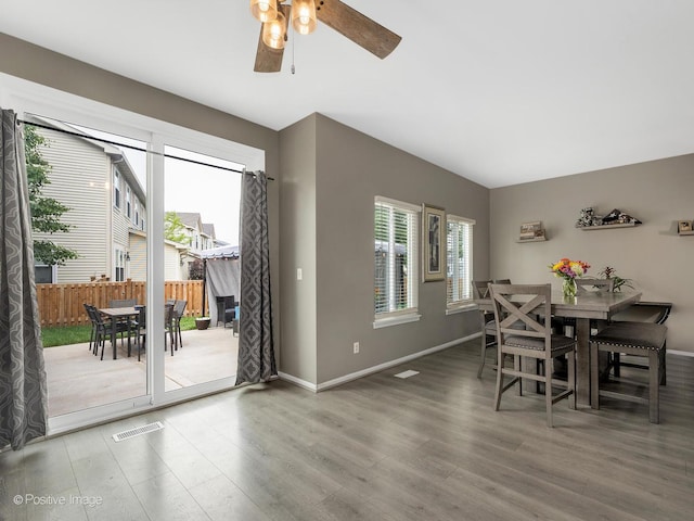 308 Ramsey Dr, Romeoville, IL 60446 - dining room featuring wood finished floors and ceiling fan