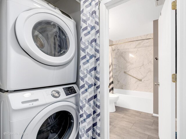 308 Ramsey Dr, Romeoville, IL 60446 - washroom featuring stacked washer / dryer