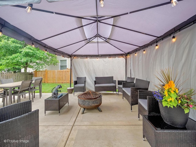308 Ramsey Dr, Romeoville, IL 60446 - view of patio / terrace featuring an outdoor living space with a fire pit, a gazebo, and outdoor dining space