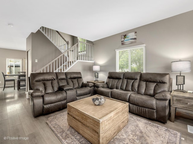 308 Ramsey Dr, Romeoville, IL 60446 - living area featuring plenty of natural light, light wood finished floors, and stairs