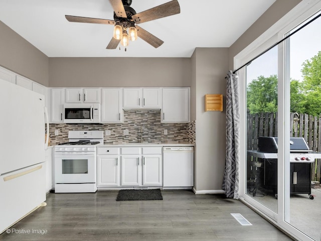 308 Ramsey Dr, Romeoville, IL 60446 - kitchen with white appliances, a ceiling fan, tasteful backsplash, light countertops, and white cabinets