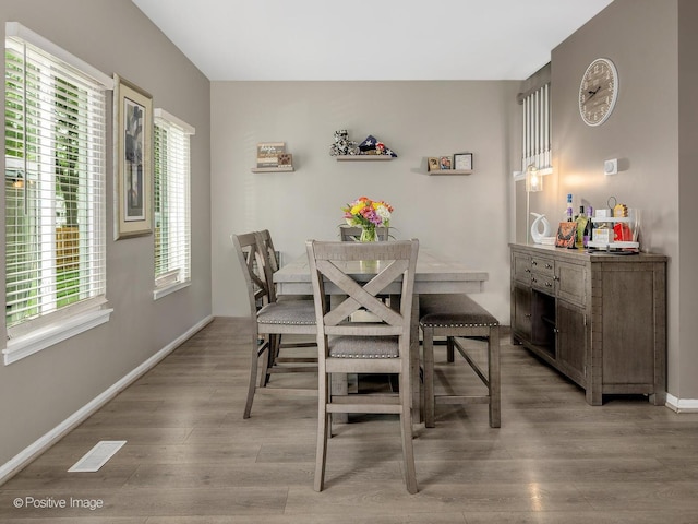 308 Ramsey Dr, Romeoville, IL 60446 - dining area featuring light wood finished floors and baseboards