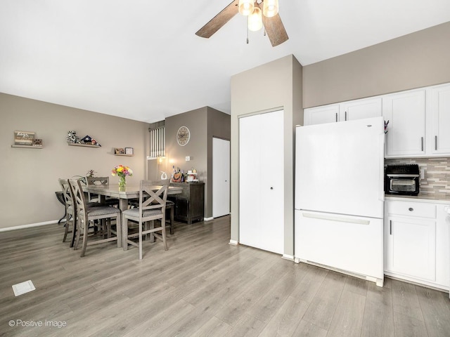 308 Ramsey Dr, Romeoville, IL 60446 - dining room with ceiling fan and light wood-style flooring