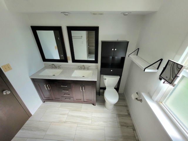 36441 N James Ct, Lake Villa, IL 60046 - bathroom featuring baseboards and double vanity