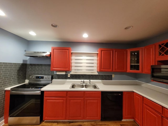 36441 N James Ct, Lake Villa, IL 60046 - kitchen featuring stainless steel appliances, under cabinet range hood, light countertops, reddish brown cabinets, and recessed lighting