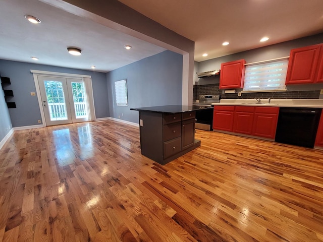 36441 N James Ct, Lake Villa, IL 60046 - kitchen featuring black dishwasher, stainless steel electric stove, light wood-style floors, backsplash, and open floor plan