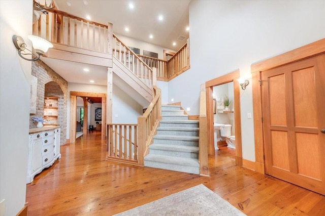2 Timber Ridge Ln, Mansfield, IL 61854 - entrance foyer with light wood-style floors, a high ceiling, stairs, and recessed lighting