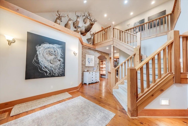2 Timber Ridge Ln, Mansfield, IL 61854 - stairway with wood finished floors, a high ceiling, and recessed lighting