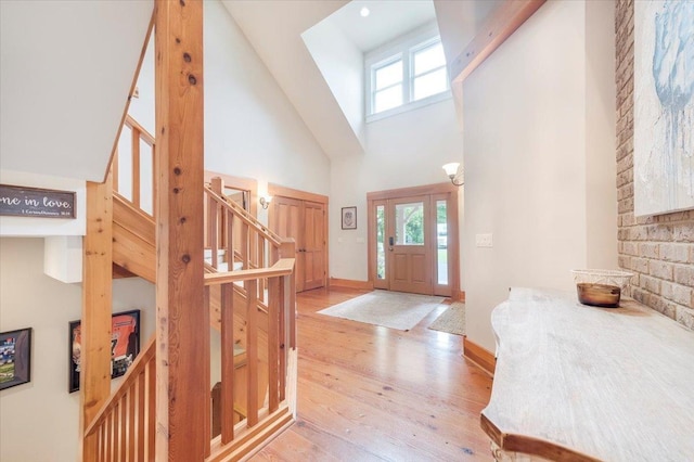 2 Timber Ridge Ln, Mansfield, IL 61854 - entryway featuring a high ceiling, healthy amount of natural light, light wood-type flooring, and stairs