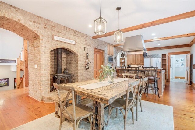 2 Timber Ridge Ln, Mansfield, IL 61854 - dining space with light wood-style floors, recessed lighting, brick wall, and a wood stove
