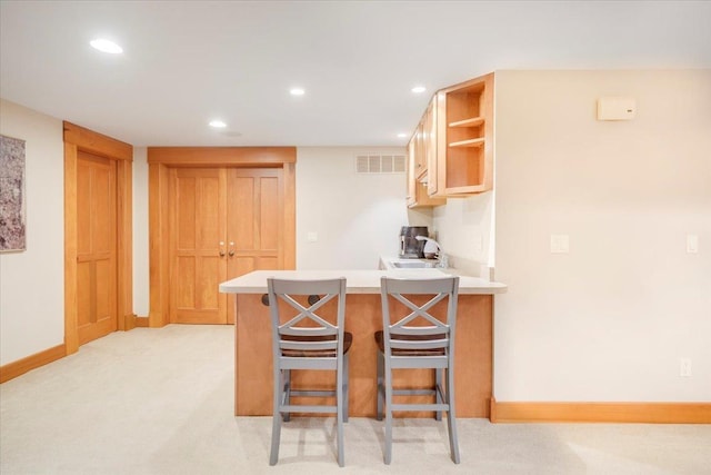 2 Timber Ridge Ln, Mansfield, IL 61854 - kitchen with a peninsula, open shelves, recessed lighting, a kitchen breakfast bar, and light countertops