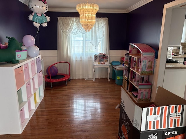 2109 Gray Hawk Dr, Plainfield, IL 60586 - game room featuring a wainscoted wall, wood finished floors, a chandelier, and crown molding