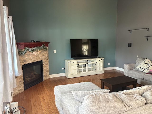 2109 Gray Hawk Dr, Plainfield, IL 60586 - living area featuring a fireplace, wood finished floors, and a towering ceiling