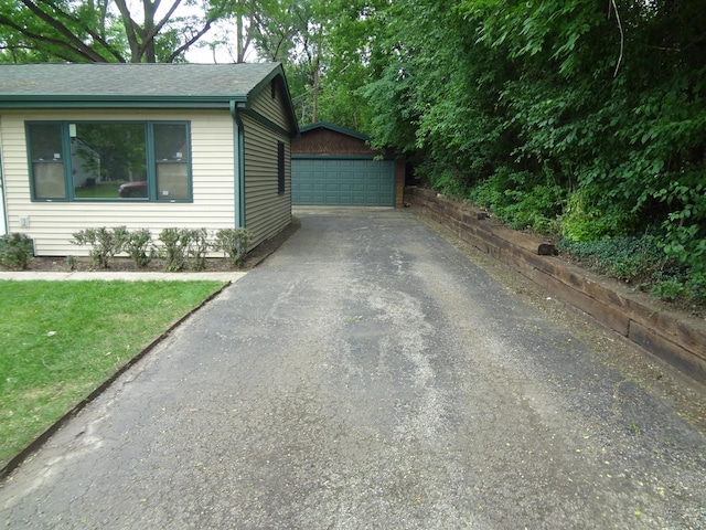 9802 Gallek Rd, Fox River Grove, IL 60021 - view of side of property featuring a garage, an outdoor structure, and a shingled roof