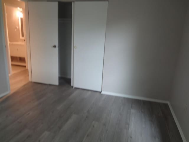 9802 Gallek Rd, Fox River Grove, IL 60021 - unfurnished bedroom featuring wood finished floors and a closet