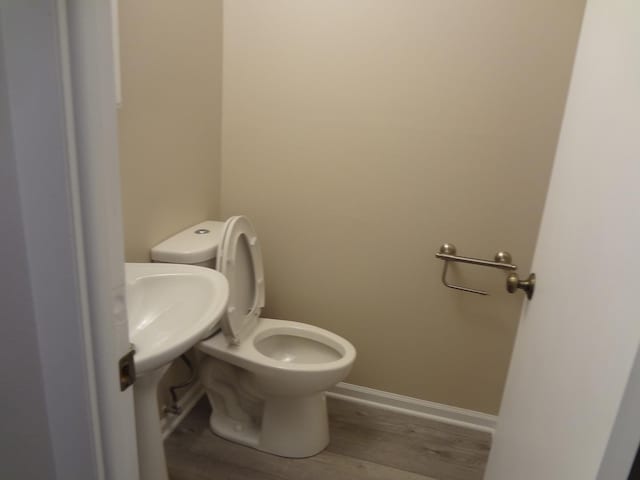 9802 Gallek Rd, Fox River Grove, IL 60021 - bathroom featuring wood finished floors and toilet