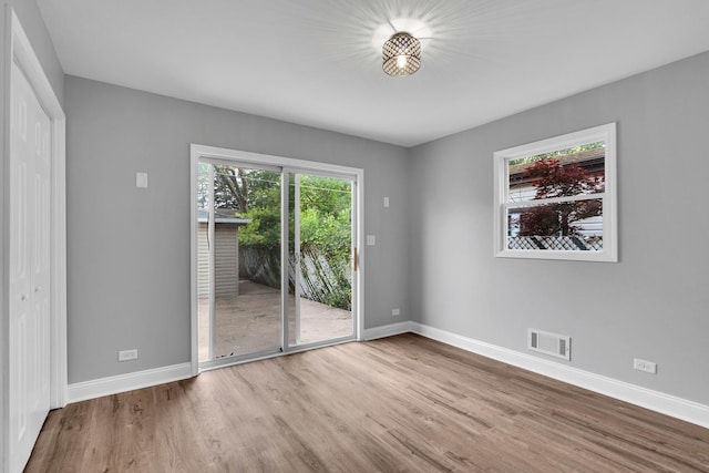 5707 W 82nd Pl, Burbank, IL 60459 - empty room featuring wood finished floors