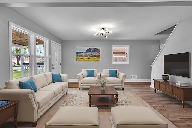 5707 W 82nd Pl, Burbank, IL 60459 - living room with light wood-type flooring and a chandelier