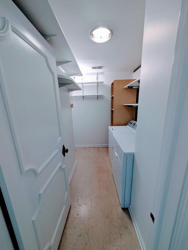 1125 Lake Cook Rd Unit 209, Northbrook, IL 60062 - laundry room featuring washer and dryer and light floors