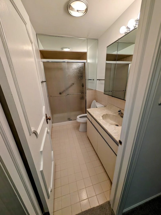 1125 Lake Cook Rd Unit 209, Northbrook, IL 60062 - full bath featuring tile patterned flooring, vanity, and a stall shower