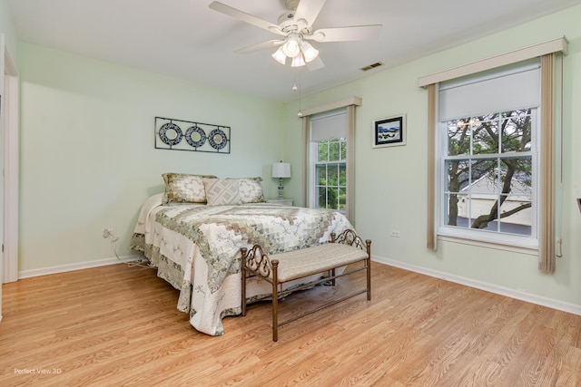 13832 S Balsam Ln Unit B, Plainfield, IL 60544 - bedroom with light wood-style flooring and a ceiling fan