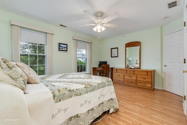 13832 S Balsam Ln Unit B, Plainfield, IL 60544 - bedroom with light wood finished floors, an office area, and a ceiling fan
