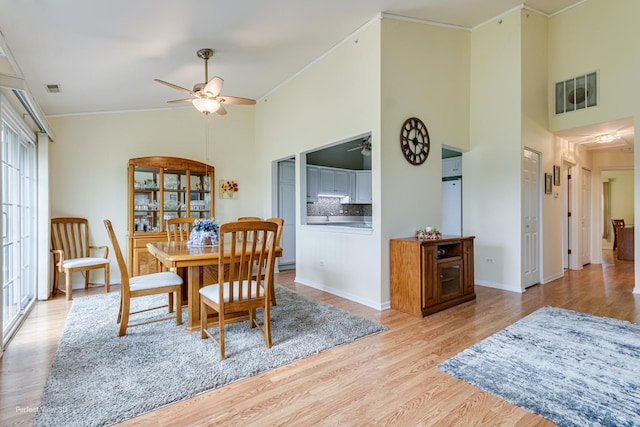 13832 S Balsam Ln Unit B, Plainfield, IL 60544 - dining space featuring a ceiling fan, high vaulted ceiling, crown molding, and wood finished floors
