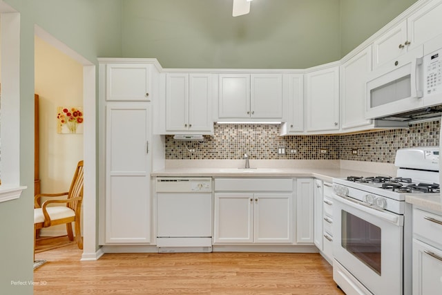 13832 S Balsam Ln Unit B, Plainfield, IL 60544 - kitchen featuring white appliances, tasteful backsplash, light countertops, and white cabinetry