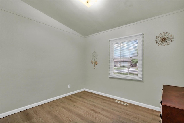 1825 Parkdale Dr, Champaign, IL 61821 - unfurnished room with wood finished floors and vaulted ceiling