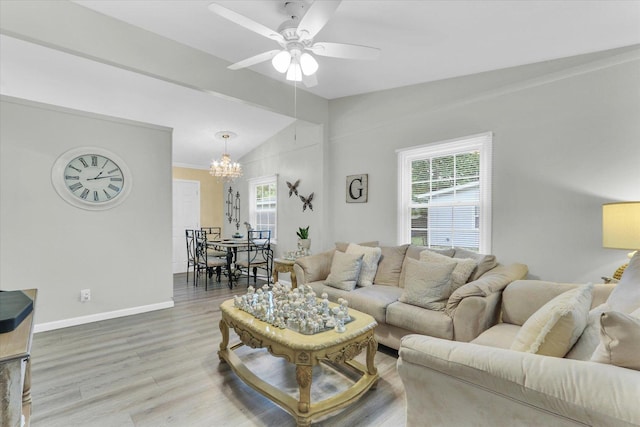 1825 Parkdale Dr, Champaign, IL 61821 - living area featuring lofted ceiling, a chandelier, wood finished floors, and ceiling fan