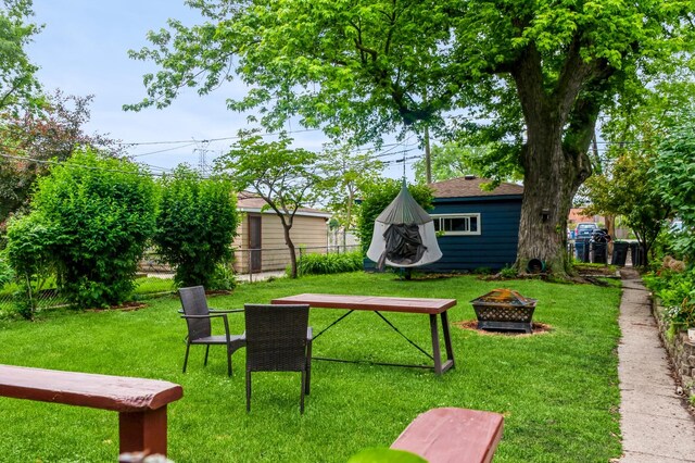 928 Grey Ave, Evanston, IL 60202 - view of yard with an outdoor fire pit and an outbuilding