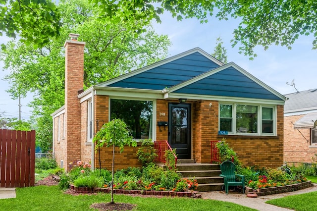 928 Grey Ave, Evanston, IL 60202 - bungalow-style house with a chimney and brick siding