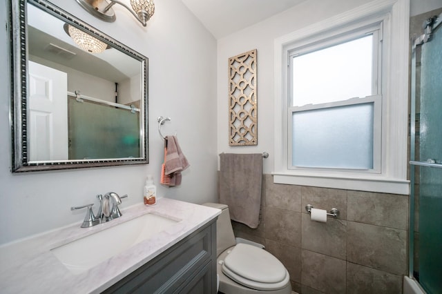 928 Grey Ave, Evanston, IL 60202 - full bathroom featuring an enclosed shower, vanity, and tile walls