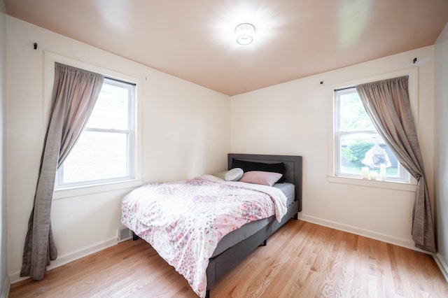 928 Grey Ave, Evanston, IL 60202 - bedroom with light wood-type flooring and multiple windows