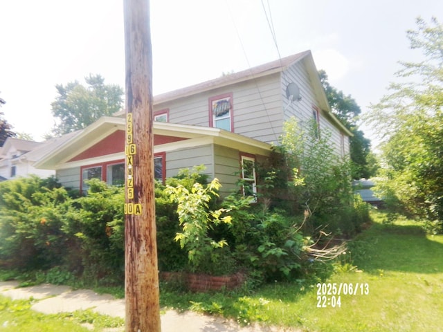 503 E Mason St E, Polo, IL 61064 - view of property exterior featuring a lawn