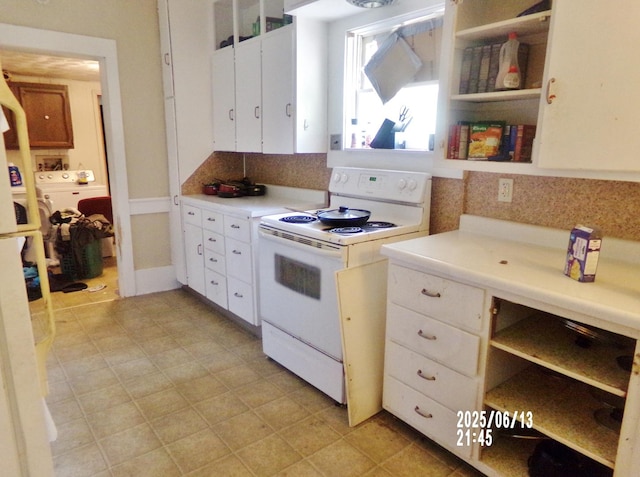 503 E Mason St E, Polo, IL 61064 - kitchen featuring white range with electric stovetop, light countertops, open shelves, and washer / clothes dryer