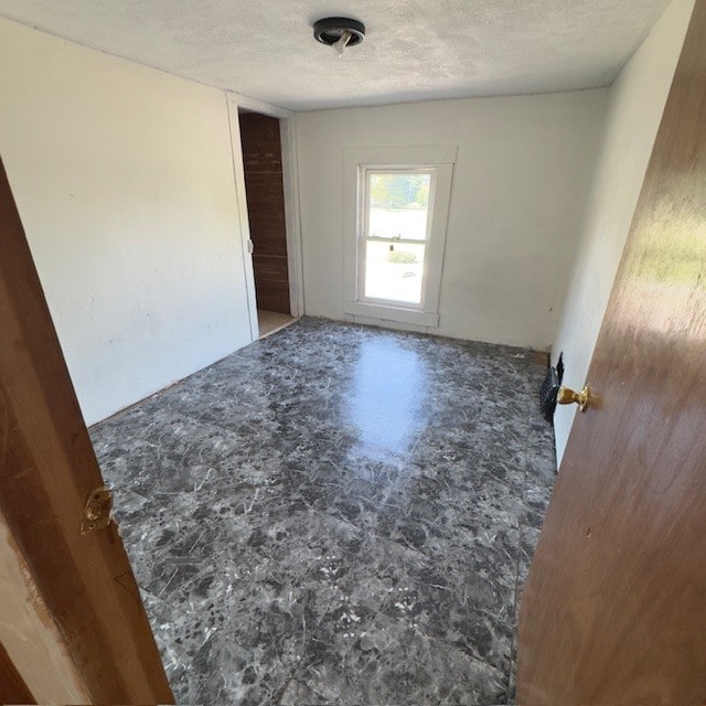 503 E Mason St E, Polo, IL 61064 - spare room featuring a textured ceiling