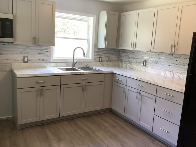 6643 S 13370e Rd, Pembroke Twp, IL 60958 - kitchen with stainless steel microwave, gray cabinets, and decorative backsplash