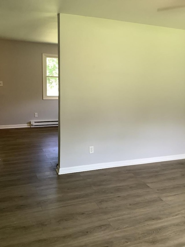 6643 S 13370e Rd, Pembroke Twp, IL 60958 - unfurnished room with dark wood-style floors and baseboard heating