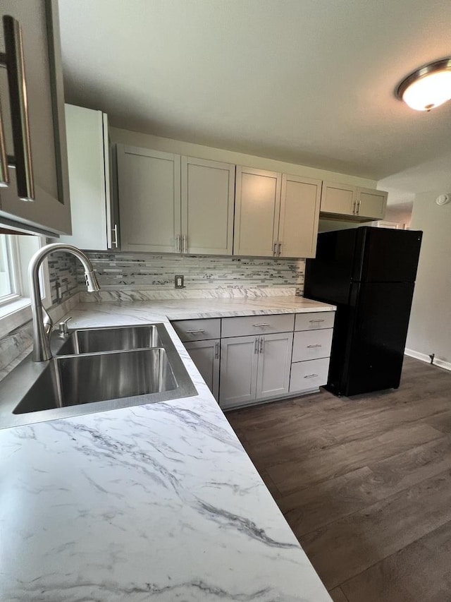 6643 S 13370e Rd, Pembroke Twp, IL 60958 - kitchen featuring freestanding refrigerator, decorative backsplash, dark wood-style flooring, gray cabinets, and light stone countertops