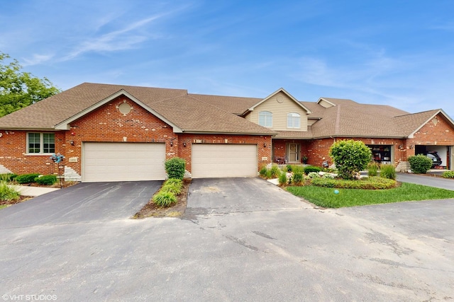 14948 S Preserve Dr, Lockport, IL 60441 - view of front of property with brick siding, asphalt driveway, an attached garage, and a shingled roof