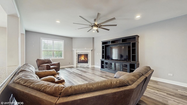 14948 S Preserve Dr, Lockport, IL 60441 - living area featuring a ceiling fan, wood finished floors, a stone fireplace, and recessed lighting
