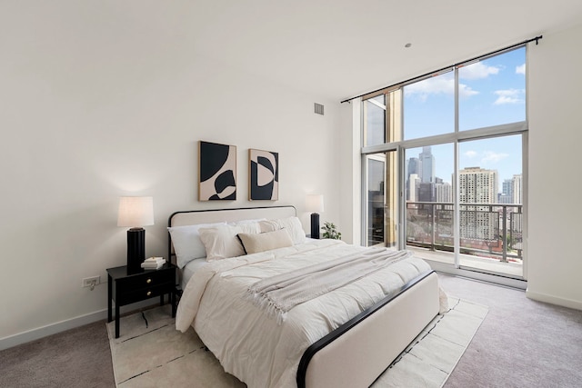 700 N Larrabee St Unit 2010, Chicago, IL 60654 - bedroom with light carpet, access to outside, a wall of windows, and a view of skyline