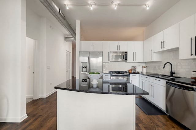 700 N Larrabee St Unit 2010, Chicago, IL 60654 - kitchen with appliances with stainless steel finishes, tasteful backsplash, dark wood-style floors, and a center island