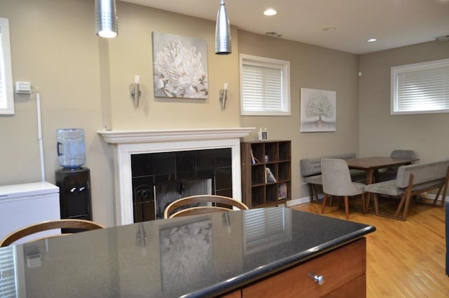 4435 S Oakenwald Ave Unit 1, Chicago, IL 60653 - living area with light wood-style floors, a fireplace, and recessed lighting