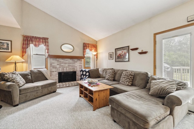 307 Valley Rd, North Aurora, IL 60542 - living room featuring light carpet, high vaulted ceiling, and a fireplace